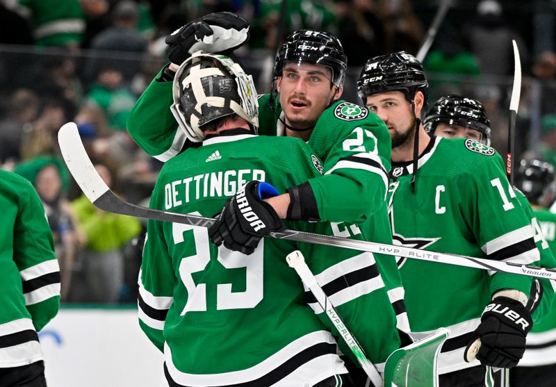 Jan 16, 2024; Dallas, Texas, USA; Dallas Stars goaltender Jake Oettinger (29) and left wing Mason Marchment (27) and left wing Jamie Benn (14) celebrate on the ice after the Stars victory over the Los Angeles Kings at the American Airlines Center. Mandatory Credit: Jerome Miron-USA TODAY Sports