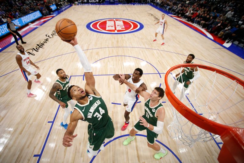 DETROIT, MI - JANUARY 22:  Giannis Antetokounmpo #34 of the Milwaukee Bucks rebounds the ball during the game against the Detroit Pistons on January 22, 2024 at Little Caesars Arena in Detroit, Michigan. NOTE TO USER: User expressly acknowledges and agrees that, by downloading and/or using this photograph, User is consenting to the terms and conditions of the Getty Images License Agreement. Mandatory Copyright Notice: Copyright 2024 NBAE (Photo by Brian Sevald/NBAE via Getty Images)