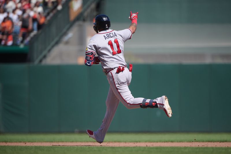 Aug 26, 2023; San Francisco, California, USA; Atlanta Braves infielder Orlando Arcia (11) runs the bases and gestures toward the Braves bullpen after hitting a solo home run against the San Francisco Giants during the sixth inning at Oracle Park. Mandatory Credit: Robert Edwards-USA TODAY Sports