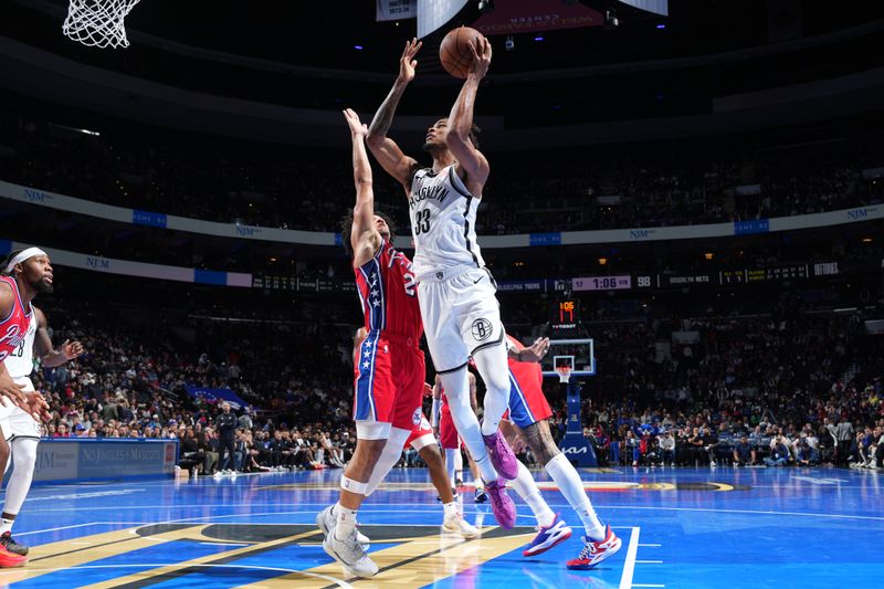 PHILADELPHIA, PA - NOVEMBER 22: Nicolas Claxton #33 of the Brooklyn Nets drives to the basket during the game against the Philadelphia 76ers during the Emirates NBA Cup game on November 22, 2024 at the Wells Fargo Center in Philadelphia, Pennsylvania NOTE TO USER: User expressly acknowledges and agrees that, by downloading and/or using this Photograph, user is consenting to the terms and conditions of the Getty Images License Agreement. Mandatory Copyright Notice: Copyright 2024 NBAE (Photo by Jesse D. Garrabrant/NBAE via Getty Images)