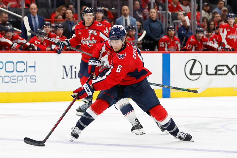 Sep 27, 2024; Washington, District of Columbia, USA; Washington Capitals defenseman Jakob Chychrun (6) passes the puck against the Columbus Blue Jackets in the third period at Capital One Arena. Mandatory Credit: Geoff Burke-Imagn Images