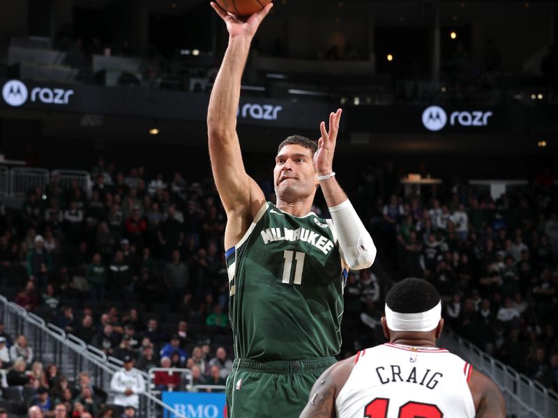 MILWAUKEE, WI - NOVEMBER 20: Brook Lopez #11 of the Milwaukee Bucks shoots the ball during the game against the Chicago Bulls on November 20, 2024 at the Fiserv Forum Center in Milwaukee, Wisconsin. NOTE TO USER: User expressly acknowledges and agrees that, by downloading and or using this Photograph, user is consenting to the terms and conditions of the Getty Images License Agreement. Mandatory Copyright Notice: Copyright 2024 NBAE (Photo by Gary Dineen/NBAE via Getty Images).