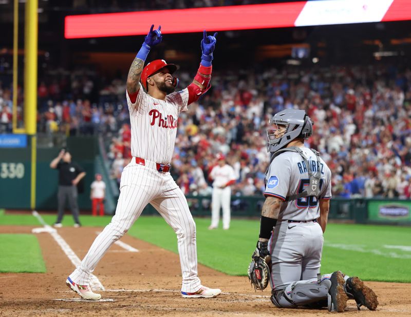 Sep 24, 2025; Philadelphia, Pennsylvania, USA; Philadelphia Phillies short stop Edmundo Sosa (33) celebrates in front of Miami Marlins catcher Agustín Ramírez (50) after hitting a three RBI home run during the fifth inning at Citizens Bank Park. Mandatory Credit: Bill Streicher-Imagn Images