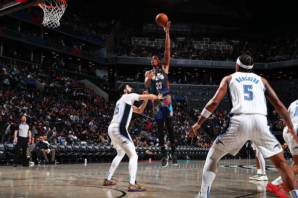 BROOKLYN, NY - DECEMBER 2: Nicolas Claxton #33 of the Brooklyn Nets shoots the ball during the game against the Orlando Magic on December 2, 2023 at Barclays Center in Brooklyn, New York. NOTE TO USER: User expressly acknowledges and agrees that, by downloading and or using this Photograph, user is consenting to the terms and conditions of the Getty Images License Agreement. Mandatory Copyright Notice: Copyright 2023 NBAE (Photo by David L. Nemec/NBAE via Getty Images)