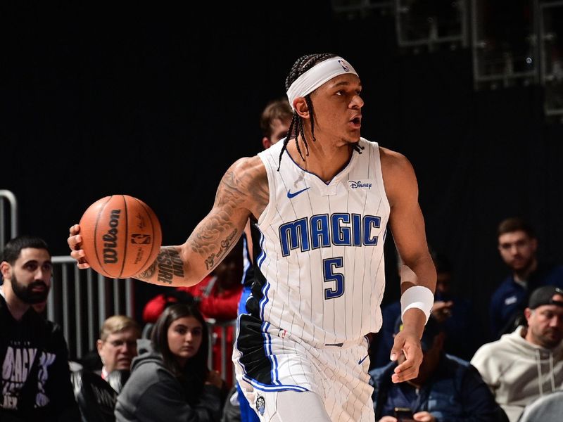 DETROIT, MI - FEBRUARY 4: Paolo Banchero #5 of the Orlando Magic handles the ball during the game  against the Detroit Pistons on February 4, 2024 at Little Caesars Arena in Detroit, Michigan. NOTE TO USER: User expressly acknowledges and agrees that, by downloading and/or using this photograph, User is consenting to the terms and conditions of the Getty Images License Agreement. Mandatory Copyright Notice: Copyright 2024 NBAE (Photo by Chris Schwegler/NBAE via Getty Images)