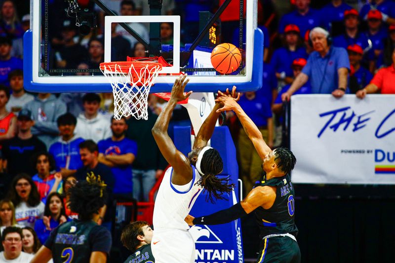 Feb 20, 2024; Boise, Idaho, USA; San Jose State Spartans guard Myron Amey Jr. (0) blocks the shot of Boise State Broncos forward O'Mar Stanley (1) during the first half at  ExtraMile Arena. Mandatory Credit: Brian Losness-USA TODAY Sports