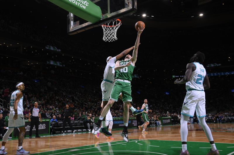 BOSTON, MA - APRIL 12:  Luke Kornet #40 of the Boston Celtics drives to the basket during the game against the Charlotte Hornets on April 12, 2024 at the TD Garden in Boston, Massachusetts. NOTE TO USER: User expressly acknowledges and agrees that, by downloading and or using this photograph, User is consenting to the terms and conditions of the Getty Images License Agreement. Mandatory Copyright Notice: Copyright 2024 NBAE  (Photo by Brian Babineau/NBAE via Getty Images)