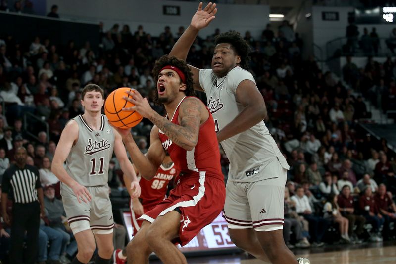 Jan 13, 2026; Starkville, Mississippi, USA; Alabama Crimson Tide forward Amari Allen (5) drives to the basket as Mississippi State Bulldogs forward Brandon Walker (4) defends during the second half at Humphrey Coliseum. Mandatory Credit: Petre Thomas-Imagn Images