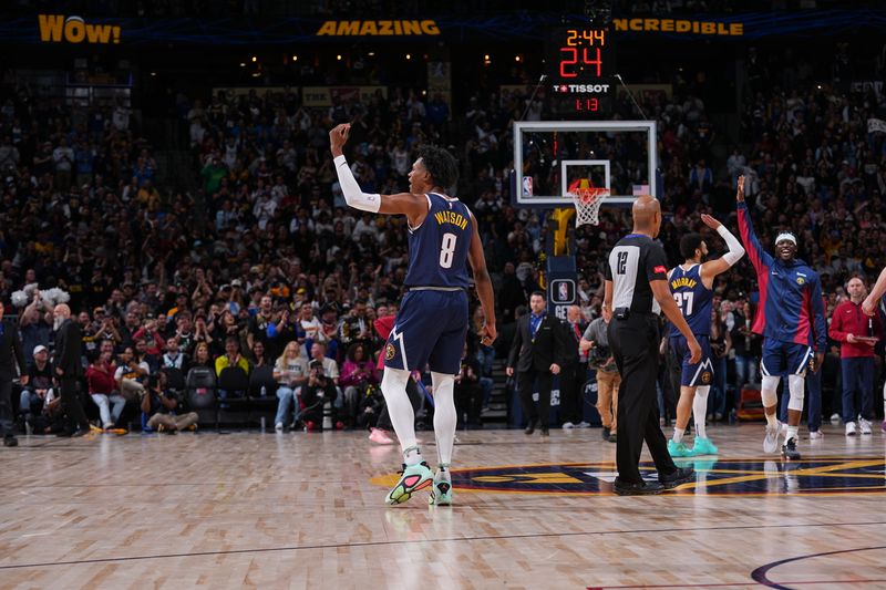 DENVER, CO - APRIL 10: Peyton Watson #8 of the Denver Nuggets celebrates a dunk during the game against the Minnesota Timberwolves on April 10, 2024 at the Ball Arena in Denver, Colorado. NOTE TO USER: User expressly acknowledges and agrees that, by downloading and/or using this Photograph, user is consenting to the terms and conditions of the Getty Images License Agreement. Mandatory Copyright Notice: Copyright 2024 NBAE (Photo by Bart Young/NBAE via Getty Images)