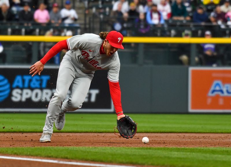 May 13, 2023; Denver, Colorado, USA;  Philadelphia Phillies third baseman Alec Bohm (28) scoops a ball to throw the runner out at first in the first inning against the Colorado Rockies at Coors Field. Mandatory Credit: John Leyba-USA TODAY Sports