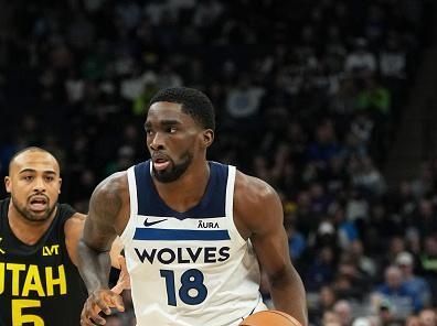 MINNEAPOLIS, MN -  NOVEMBER 30 :  Shake Milton #18 of the Minnesota Timberwolves handles the ball during the game against the Utah Jazz on November 30, 2023 at Target Center in Minneapolis, Minnesota. NOTE TO USER: User expressly acknowledges and agrees that, by downloading and or using this Photograph, user is consenting to the terms and conditions of the Getty Images License Agreement. Mandatory Copyright Notice: Copyright 2023 NBAE (Photo by Jordan Johnson/NBAE via Getty Images)