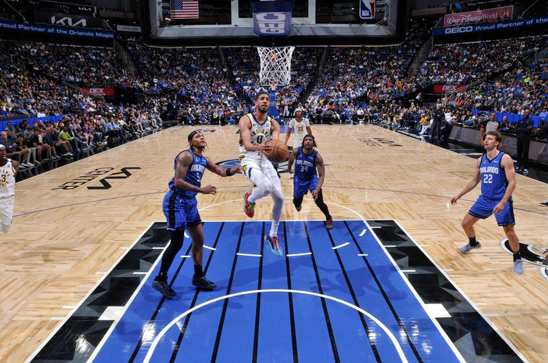 ORLANDO, FL - MARCH 10: Tyrese Haliburton #0 of the Indiana Pacers goes to the basket during the game on March 10, 2024 at Amway Center in Orlando, Florida. NOTE TO USER: User expressly acknowledges and agrees that, by downloading and or using this photograph, User is consenting to the terms and conditions of the Getty Images License Agreement. Mandatory Copyright Notice: Copyright 2024 NBAE (Photo by Fernando Medina/NBAE via Getty Images)