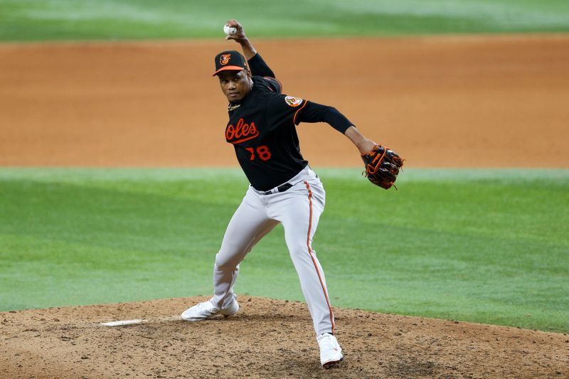 Oct 10, 2023; Arlington, Texas, USA; Baltimore Orioles relief pitcher Yennier Cano (78) pitches in the eighth inning against the Texas Rangers during game three of the ALDS for the 2023 MLB playoffs at Globe Life Field. Mandatory Credit: Andrew Dieb-USA TODAY Sports