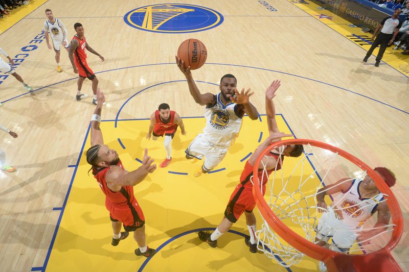 SAN FRANCISCO, CA - DECEMBER 5: Andrew Wiggins #22 of the Golden State Warriors drives to the basket during the game against the Houston Rockets on December 5, 2024 at Chase Center in San Francisco, California. NOTE TO USER: User expressly acknowledges and agrees that, by downloading and or using this photograph, user is consenting to the terms and conditions of Getty Images License Agreement. Mandatory Copyright Notice: Copyright 2024 NBAE (Photo by Noah Graham/NBAE via Getty Images)