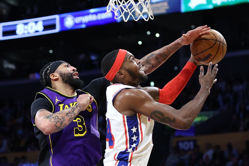 LOS ANGELES, CALIFORNIA - MARCH 22: Anthony Davis #3 of the Los Angeles Lakers blocks a shot by Paul Reed #44 of the Philadelphia 76ersduring the first half of a game at Crypto.com Arena on March 22, 2024 in Los Angeles, California. NOTE TO USER: User expressly acknowledges and agrees that, by downloading and/or using this photograph, user is consenting to the terms and conditions of the Getty Images License Agreement. (Photo by Sean M. Haffey/Getty Images)