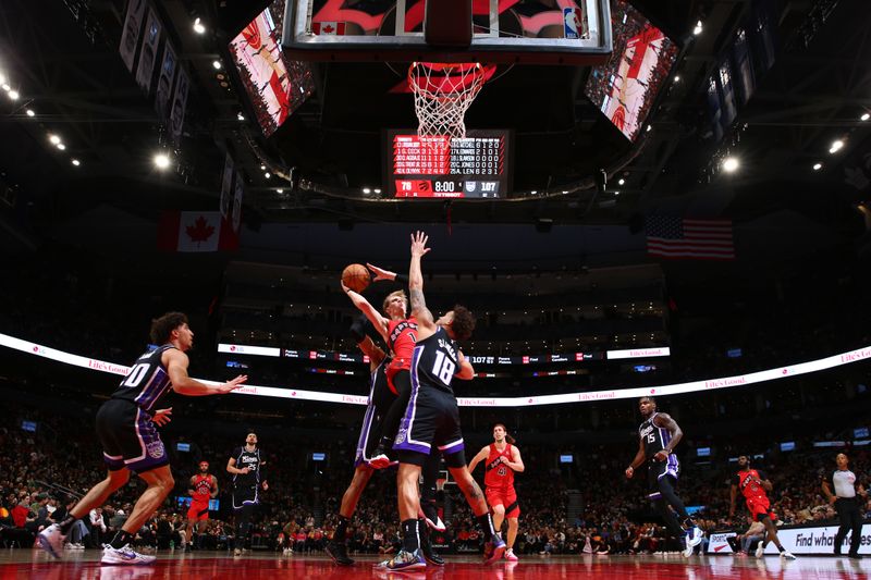 TORONTO, CANADA - MARCH 20: Gradey Dick #1 of the Toronto Raptors drives to the basket during the game against the Sacramento Kings on March 20, 2024 at the Scotiabank Arena in Toronto, Ontario, Canada.  NOTE TO USER: User expressly acknowledges and agrees that, by downloading and or using this Photograph, user is consenting to the terms and conditions of the Getty Images License Agreement.  Mandatory Copyright Notice: Copyright 2024 NBAE (Photo by Vaughn Ridley/NBAE via Getty Images)