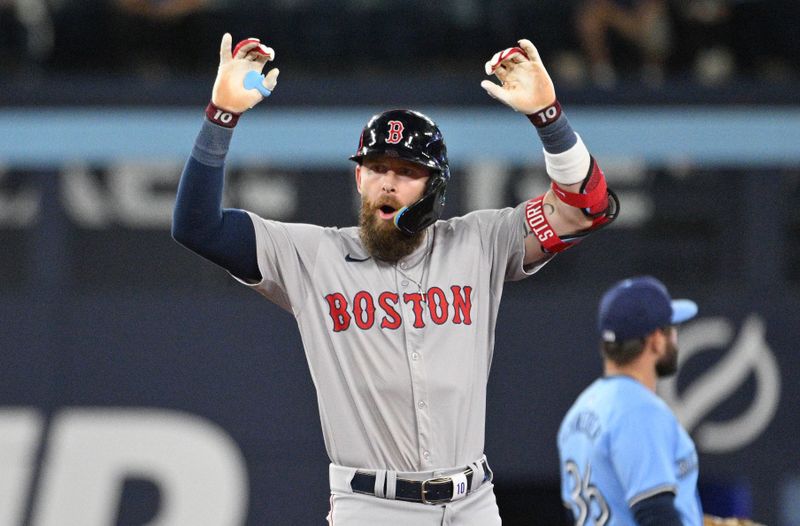 Sep 24, 2024; Toronto, Ontario, CAN;  Boston Red Sox shortstop Trevor Story (10) reacts after hitting an RBI single against the Toronto Blue Jays in the tenth inning at Rogers Centre. Mandatory Credit: Dan Hamilton-Imagn Images