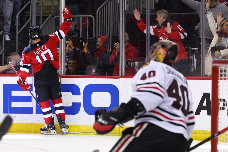 Jan 5, 2024; Newark, New Jersey, USA; New Jersey Devils right wing Alexander Holtz (10) celebrates his goal against the Chicago Blackhawks during the second period at Prudential Center. Mandatory Credit: Ed Mulholland-USA TODAY Sports