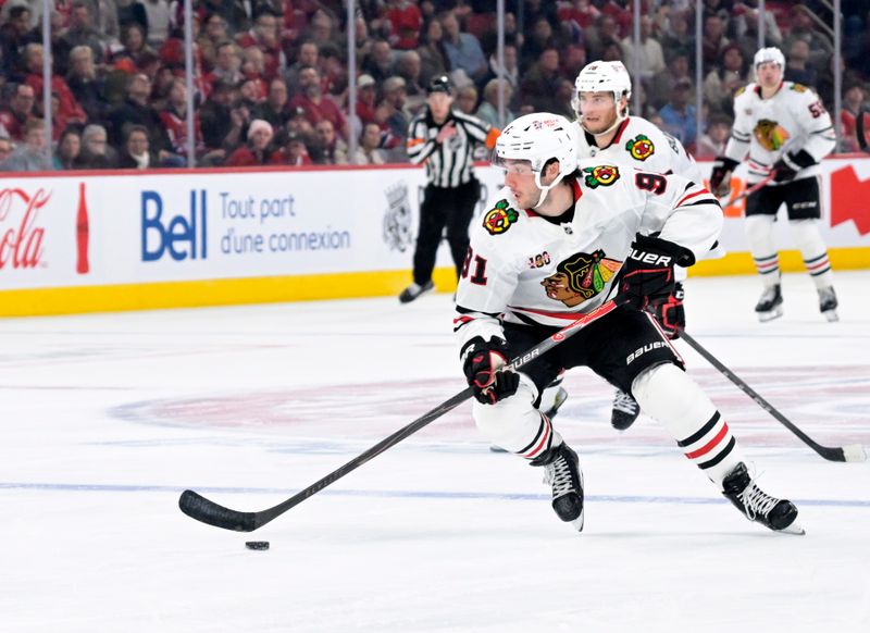 Dec 18, 2025; Montreal, Quebec, CAN; Chicago Blackhawks forward Frank Nazar (91) plays the puck during the second period against the Montreal Canadiens at the Bell Centre. Mandatory Credit: Eric Bolte-Imagn Images
