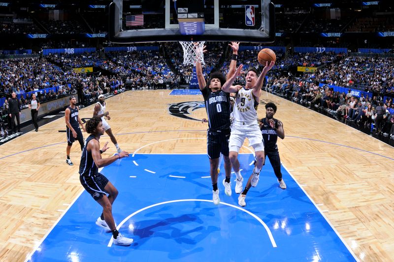 ORLANDO, FL - NOVEMBER 13: T.J. McConnell #9 of the Indiana Pacers drives to the basket during the game against the Orlando Magic on November 13, 2024 at Kia Center in Orlando, Florida. NOTE TO USER: User expressly acknowledges and agrees that, by downloading and or using this photograph, User is consenting to the terms and conditions of the Getty Images License Agreement. Mandatory Copyright Notice: Copyright 2024 NBAE (Photo by Fernando Medina/NBAE via Getty Images)