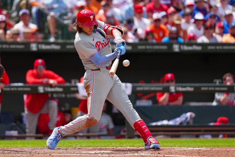 Jun 16, 2024; Baltimore, Maryland, USA; Philadelphia Phillies third baseman Alec Bohm (28) hits an RBI single against the Baltimore Orioles during the fifth inning at Oriole Park at Camden Yards. Mandatory Credit: Gregory Fisher-USA TODAY Sports