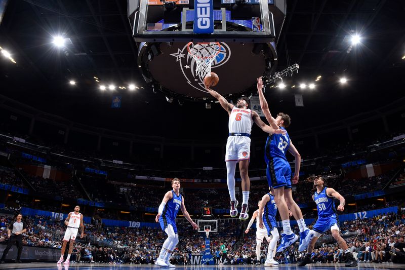 ORLANDO, FL - MARCH 23: Quentin Grimes #6 of the New York Knicks drives to the basket during the game against the Orlando Magic on March 23, 2023 at Amway Center in Orlando, Florida. NOTE TO USER: User expressly acknowledges and agrees that, by downloading and or using this photograph, User is consenting to the terms and conditions of the Getty Images License Agreement. Mandatory Copyright Notice: Copyright 2023 NBAE (Photo by Fernando Medina/NBAE via Getty Images)