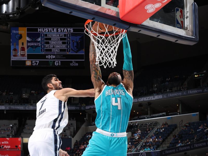 MEMPHIS, TN - OCTOBER 10: Nick Richards #4 of the Charlotte Hornets dunks the ball during the game against the Memphis Grizzlies during a NBA Preseason game on October 10, 2024 at FedExForum in Memphis, Tennessee. NOTE TO USER: User expressly acknowledges and agrees that, by downloading and or using this photograph, User is consenting to the terms and conditions of the Getty Images License Agreement. Mandatory Copyright Notice: Copyright 2024 NBAE (Photo by Joe Murphy/NBAE via Getty Images)