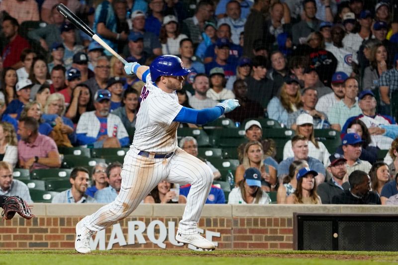 Jul 18, 2023; Chicago, Illinois, USA; Chicago Cubs left fielder Ian Happ (8) hits an RBI double against the Washington Nationals during the seventh inning at Wrigley Field. Mandatory Credit: David Banks-USA TODAY Sports