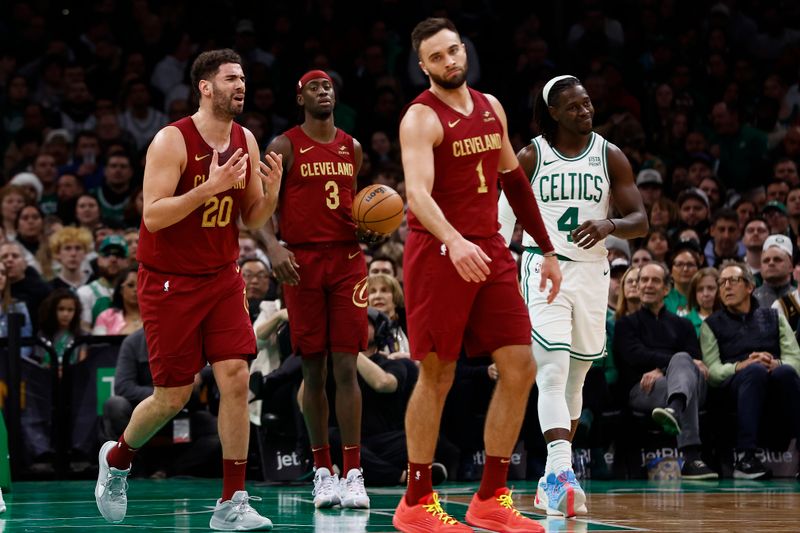 BOSTON, MA - DECEMBER 14: Georges Niang #20 of the Cleveland Cavaliers reacts to having a foul called against him during the second quarter as Jrue Holiday #4 of the Boston Celtics smiles at TD Garden on December 14, 2023 in Boston, Massachusetts. NOTE TO USER: User expressly acknowledges and agrees that, by downloading and/or using this Photograph, user is consenting to the terms and conditions of the Getty Images License Agreement. (Photo By Winslow Townson/Getty Images)