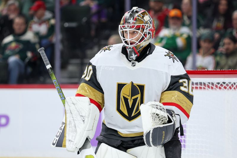 Nov 16, 2025; Saint Paul, Minnesota, USA; Vegas Golden Knights goaltender Carl Lindbom (30) defends his net against the Minnesota Wild during the second period at Grand Casino Arena. Mandatory Credit: Matt Krohn-Imagn Images