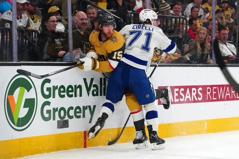 Mar 19, 2024; Las Vegas, Nevada, USA; Tampa Bay Lightning center Anthony Cirelli (71) checks Vegas Golden Knights defenseman Noah Hanifin (15) during the first period at T-Mobile Arena. Mandatory Credit: Stephen R. Sylvanie-USA TODAY Sports