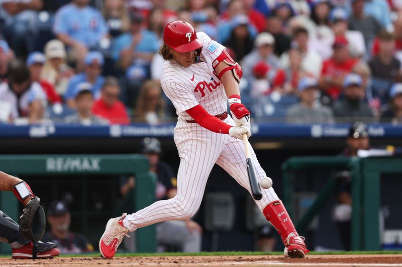 May 29, 2025; Philadelphia, Pennsylvania, USA; Philadelphia Phillies third base Alec Bohm (28) hits a single against the Atlanta Braves during the first inning at Citizens Bank Park. Mandatory Credit: Bill Streicher-Imagn Images