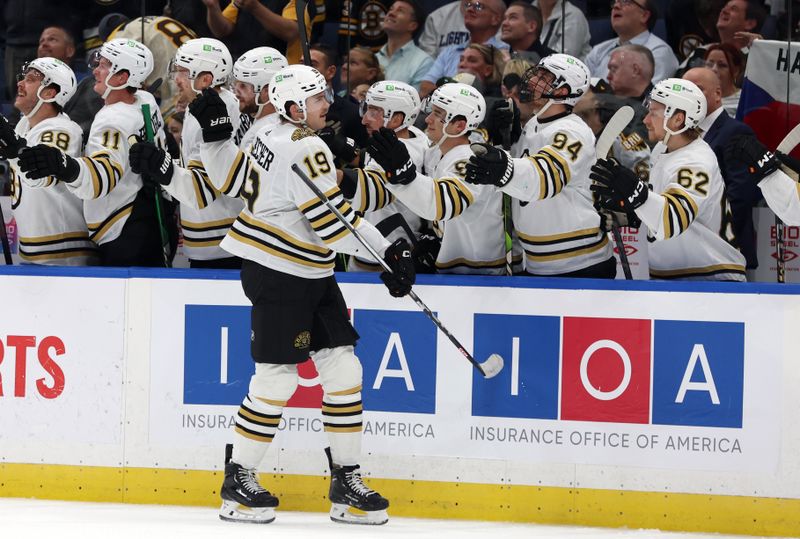 wwNov 20, 2023; Tampa, Florida, USA; Boston Bruins center Johnny Beecher (19) is congratulated after he scored against the Tampa Bay Lightning during the third period at Amalie Arena. Mandatory Credit: Kim Klement Neitzel-USA TODAY Sports