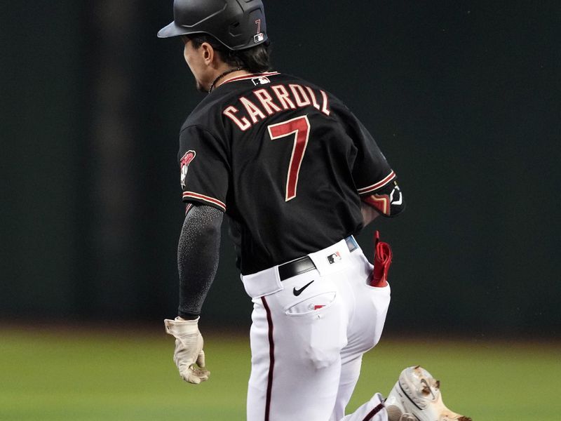 Aug 26, 2023; Phoenix, Arizona, USA; Arizona Diamondbacks left fielder Corbin Carroll (7) runs the bases en route to a triple against the Cincinnati Reds during the first inning at Chase Field. Mandatory Credit: Joe Camporeale-USA TODAY Sports