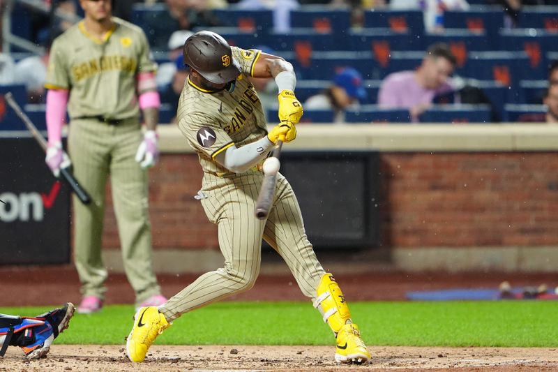 Jun 14, 2024; New York City, New York, USA; San Diego Padres left fielder Jurickson Profar (10) hits a single down the right field line against the New York Mets during the fourth inning at Citi Field. Mandatory Credit: Gregory Fisher-USA TODAY Sports