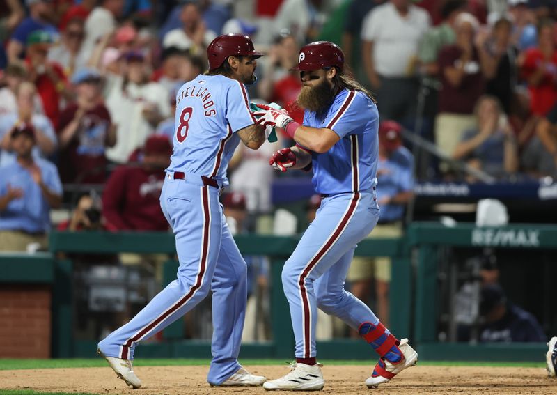 Aug 29, 2024; Philadelphia, Pennsylvania, USA; Philadelphia Phillies outfielder Brandon Marsh (16) celebrates with outfielder Nick Castellanos (8) after hitting a three RBI home run during the sixth inning against the Atlanta Braves at Citizens Bank Park. Mandatory Credit: Bill Streicher-USA TODAY Sports