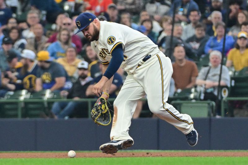 May 24, 2023; Milwaukee, Wisconsin, USA; Milwaukee Brewers first baseman Rowdy Tellez (11) drops a ground ball hit by Houston Astros second baseman Mauricio Dubon (not pictured) for an error in the sixth inning at American Family Field. Mandatory Credit: Benny Sieu-USA TODAY Sports