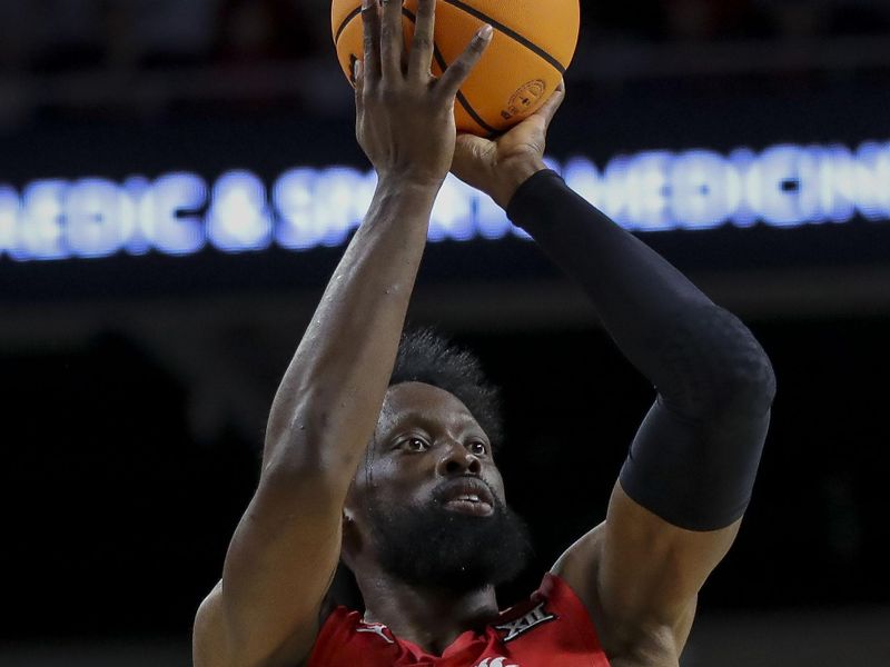 Mar 9, 2024; Cincinnati, Ohio, USA; Cincinnati Bearcats forward John Newman III (15) shoots against the West Virginia Mountaineers in the first half at Fifth Third Arena. Mandatory Credit: Katie Stratman-USA TODAY Sports