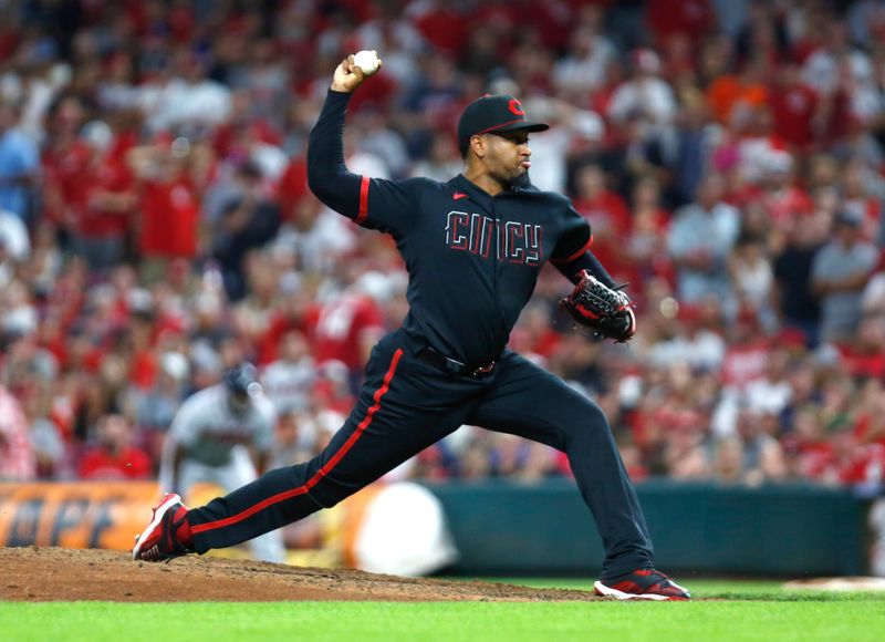 Jun 23, 2023; Cincinnati, Ohio, USA; Cincinnati Reds relief pitcher Alexis Diaz (43) delivers a pitch against the Atlanta Braves during the ninth inning at Great American Ball Park. Mandatory Credit: David Kohl-USA TODAY Sports