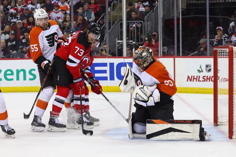 Dec 19, 2023; Newark, New Jersey, USA; Philadelphia Flyers goaltender Samuel Ersson (33) makes a save against the New Jersey Devils during the second period at Prudential Center. Mandatory Credit: Ed Mulholland-USA TODAY Sports