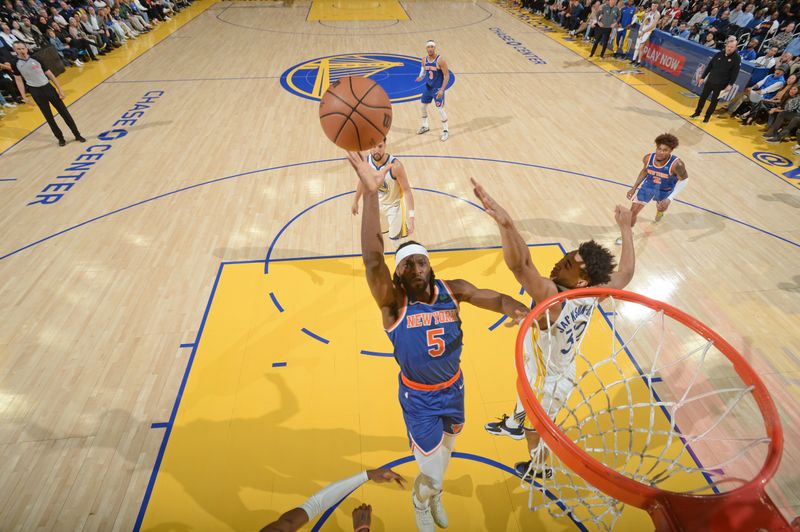 SAN FRANCISCO, CA - MARCH 18: Precious Achiuwa #5 of the New York Knicks drives to the basket during the game against the Golden State Warriors on MARCH 18, 2024 at Chase Center in San Francisco, California. NOTE TO USER: User expressly acknowledges and agrees that, by downloading and or using this photograph, user is consenting to the terms and conditions of Getty Images License Agreement. Mandatory Copyright Notice: Copyright 2024 NBAE (Photo by Noah Graham/NBAE via Getty Images)