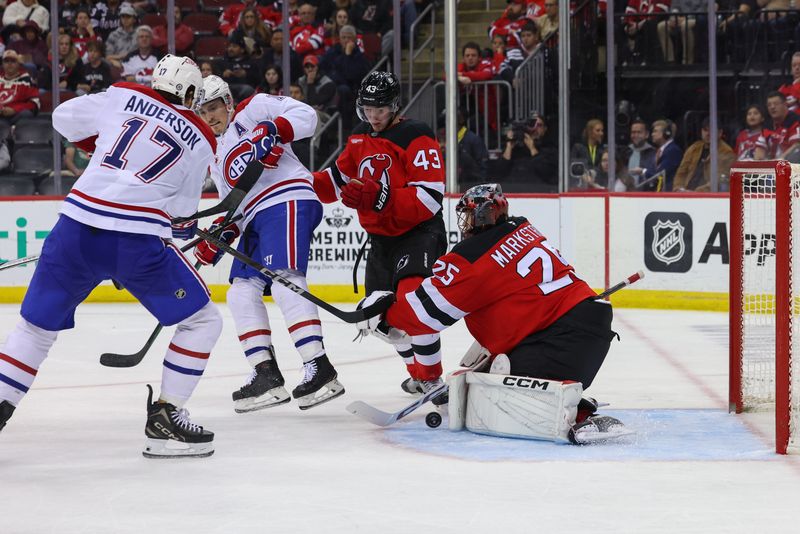 Nov 7, 2024; Newark, New Jersey, USA; New Jersey Devils goaltender Jacob Markstrom (25) makes a save against the Montreal Canadiens during the third period at Prudential Center. Mandatory Credit: Ed Mulholland-Imagn Images