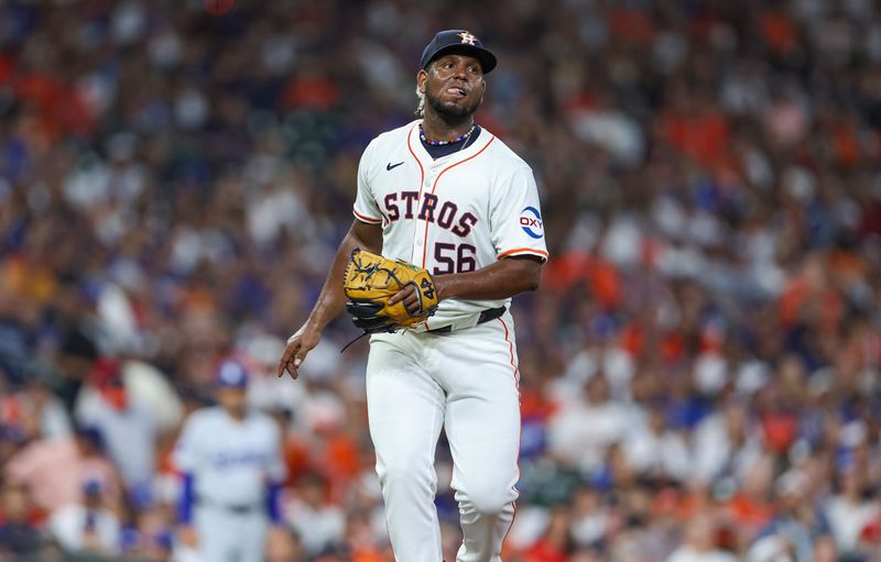 Jul 27, 2024; Houston, Texas, USA; Houston Astros starting pitcher Ronel Blanco (56) reacts to a triple hit by Los Angeles Dodgers first baseman Cavan Biggio (not pictured) during the second inning at Minute Maid Park. Mandatory Credit: Troy Taormina-USA TODAY Sports