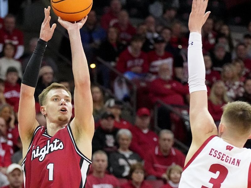 Feb. 18, 2023; Madison, WI, USA; Rutgers Scarlet Knights forward Oskar Palmquist (1) hits a three-point shot over Wisconsin Badgers guard Connor Essegian (3) during the first half at the Kohl Center. Mandatory Credit: Mark Hoffman-USA TODAY Sports