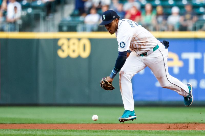 Jul 2, 2024; Seattle, Washington, USA; Seattle Mariners second baseman Jorge Polanco (7) fails to field a ground ball for a single against the Baltimore Orioles during the sixth inning at T-Mobile Park. Mandatory Credit: Joe Nicholson-USA TODAY Sports