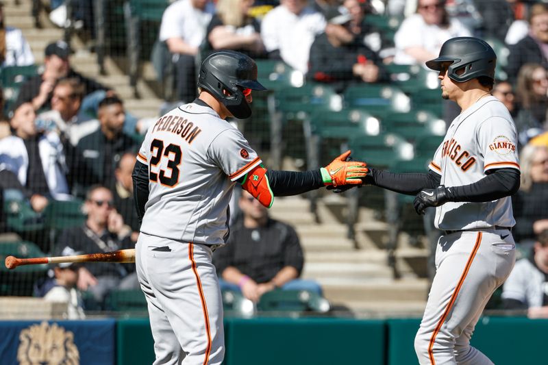 Apr 6, 2023; Chicago, Illinois, USA; San Francisco Giants first baseman Wilmer Flores (41) is congratulated by first baseman Joc Pederson (23) after hitting a two-run home run against the Chicago White Sox during the sixth inning at Guaranteed Rate Field. Mandatory Credit: Kamil Krzaczynski-USA TODAY Sports