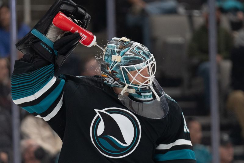 Feb 24, 2024; San Jose, California, USA; San Jose Sharks goaltender Kaapo Kahkonen (36) sprays water on himself during the first period against the Nashville Predators at SAP Center at San Jose. Mandatory Credit: Stan Szeto-USA TODAY Sports