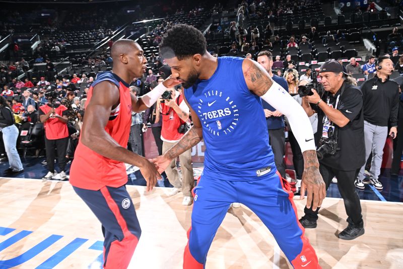 INGLEWOOD, CA - NOVEMBER 6: Kris Dunn #8 of the LA Clippers and Paul George #8 of the Philadelphia 76ers embrace before the game on November 6, 2024 at Intuit Dome in Los Angeles, California. NOTE TO USER: User expressly acknowledges and agrees that, by downloading and/or using this Photograph, user is consenting to the terms and conditions of the Getty Images License Agreement. Mandatory Copyright Notice: Copyright 2024 NBAE (Photo by Adam Pantozzi/NBAE via Getty Images)