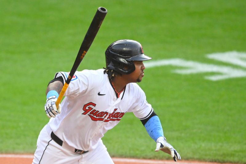 May 7, 2024; Cleveland, Ohio, USA; Cleveland Guardians third baseman Jose Ramirez (11) watches his two-RBI single in the second inning against the Detroit Tigers at Progressive Field. Mandatory Credit: David Richard-USA TODAY Sports