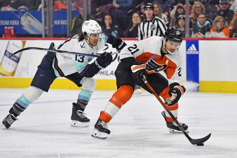 Feb 10, 2024; Philadelphia, Pennsylvania, USA; Philadelphia Flyers center Scott Laughton (21) skates past Seattle Kraken left wing Brandon Tanev (13) during the first period at Wells Fargo Center. Mandatory Credit: Eric Hartline-USA TODAY Sports